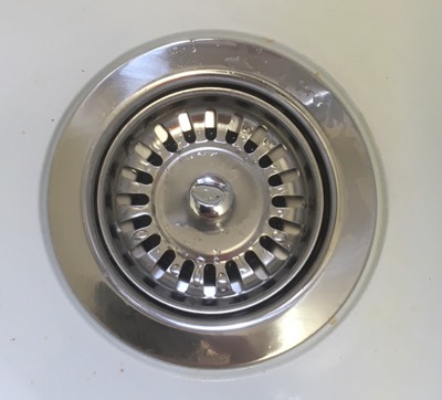 shiny stainless steel replacement waste in sink